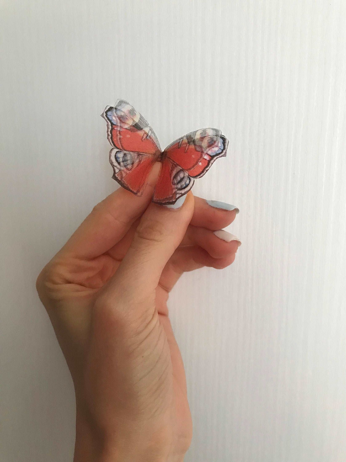 Rich red color of butterfly wings on handmade ring