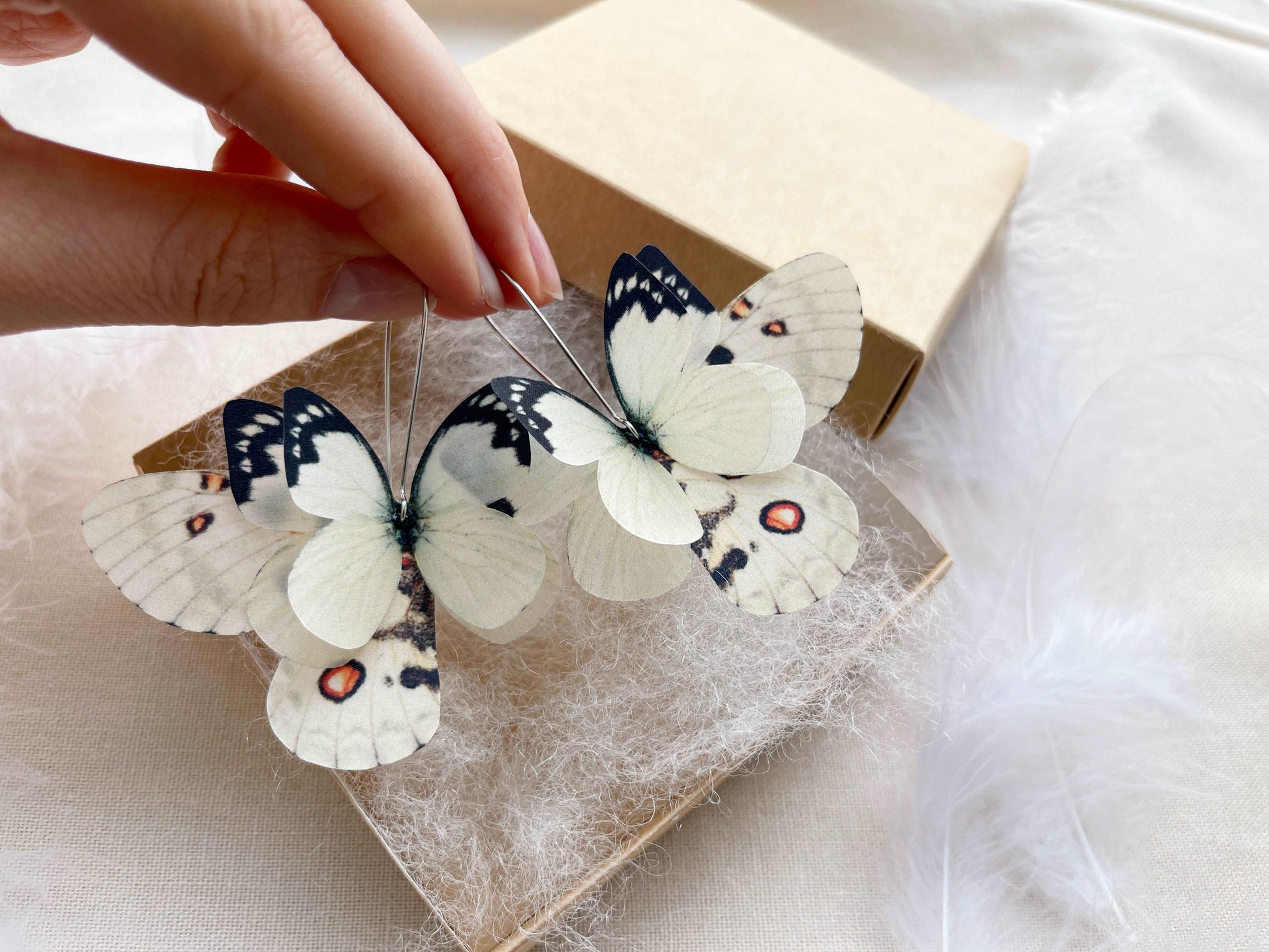 Ivory moth wing earrings in boho style