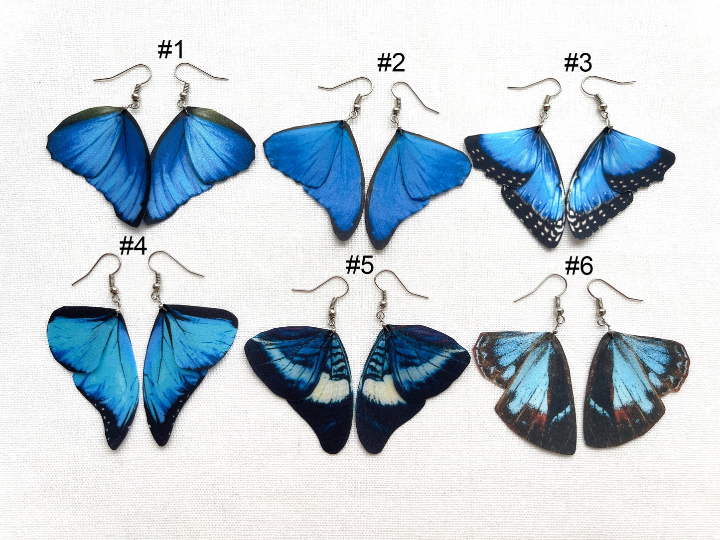 Royal blue butterfly wing earrings with watercolor design