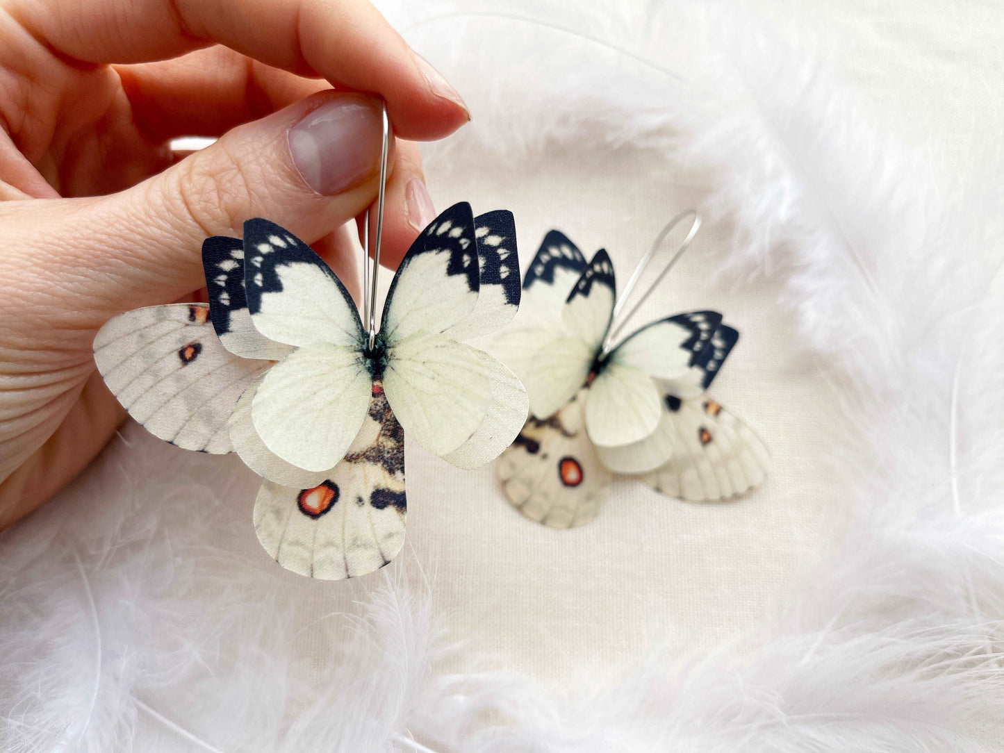 Boho chic mismatched ivory earrings with butterfly wings