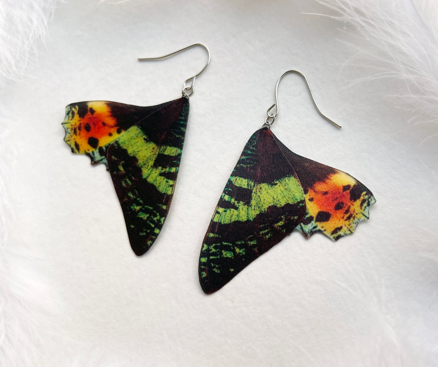 Whimsigoth-style moth wing earrings with Urania Sunset Moth design