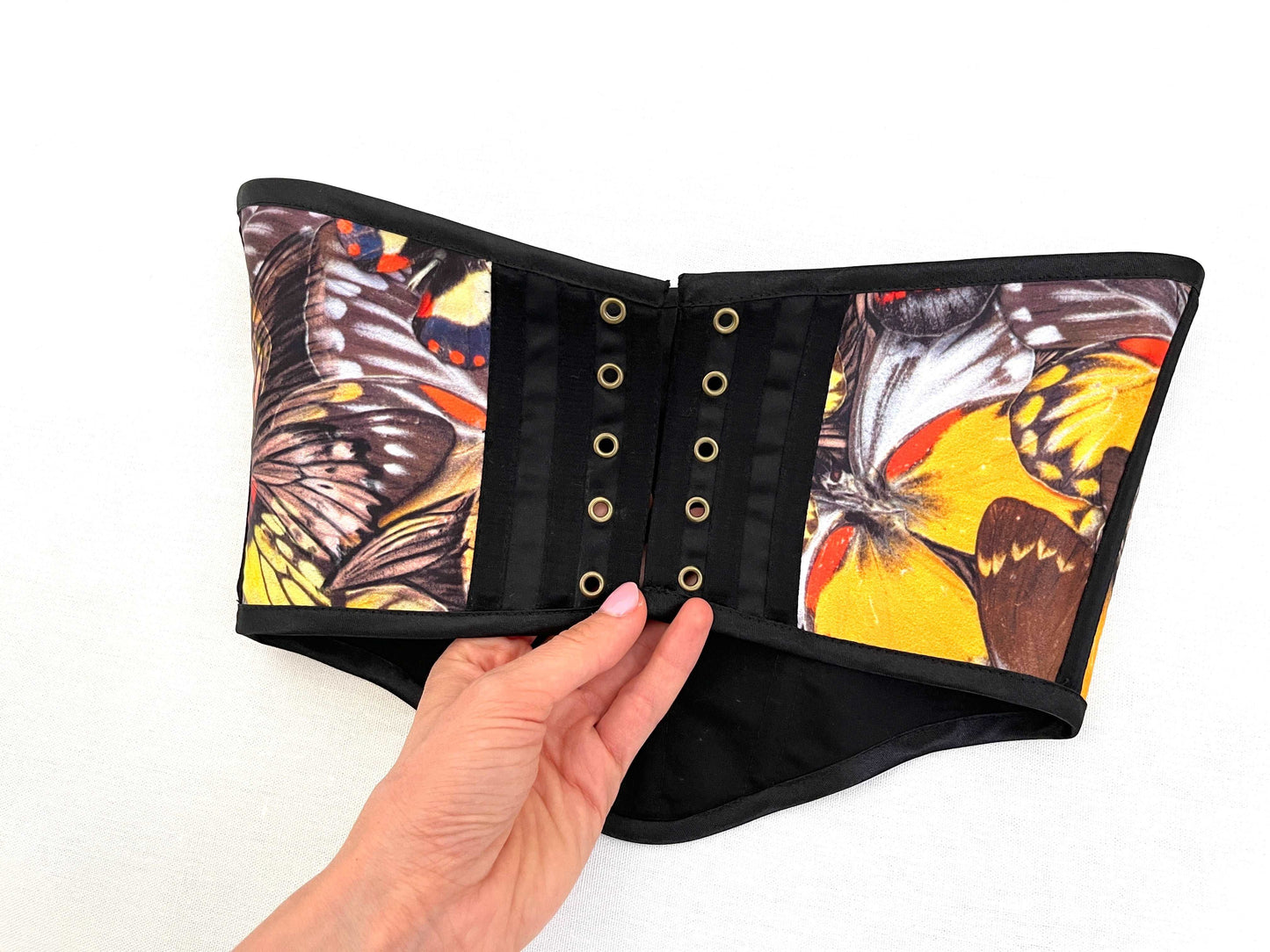 Wide black corset belt with butterfly and floral accents