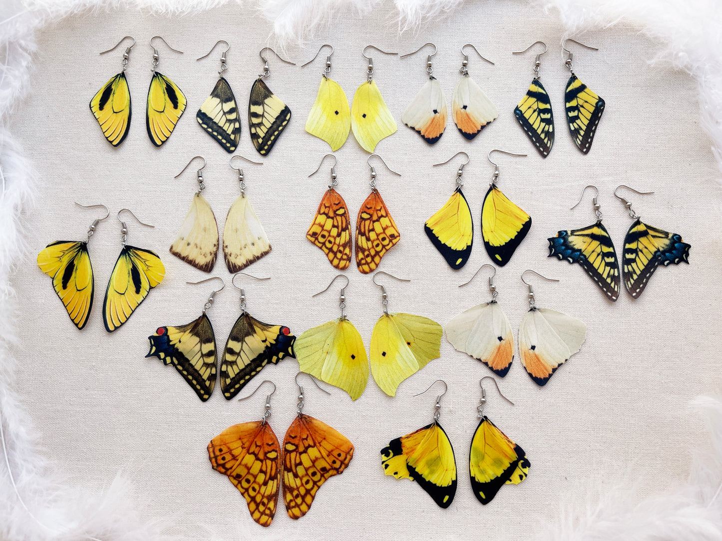 Eye-Catching Yellow Earrings with Detailed Butterfly Wing Pattern