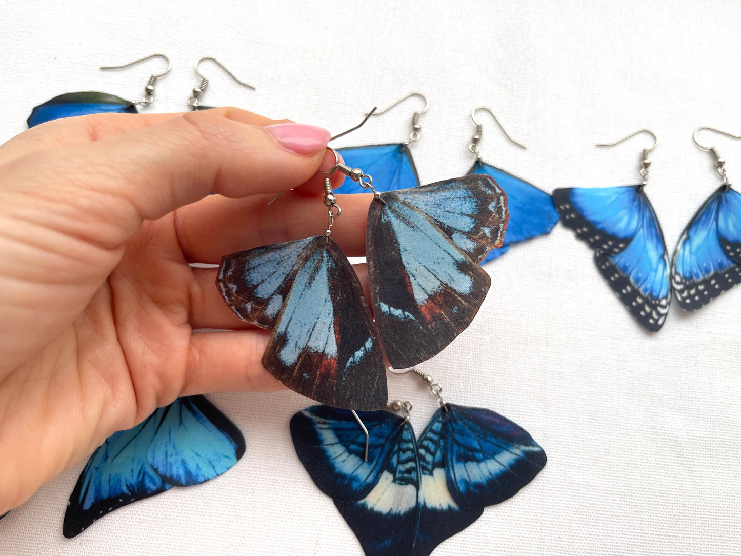Whimsical fairy wing earrings in shades of blue