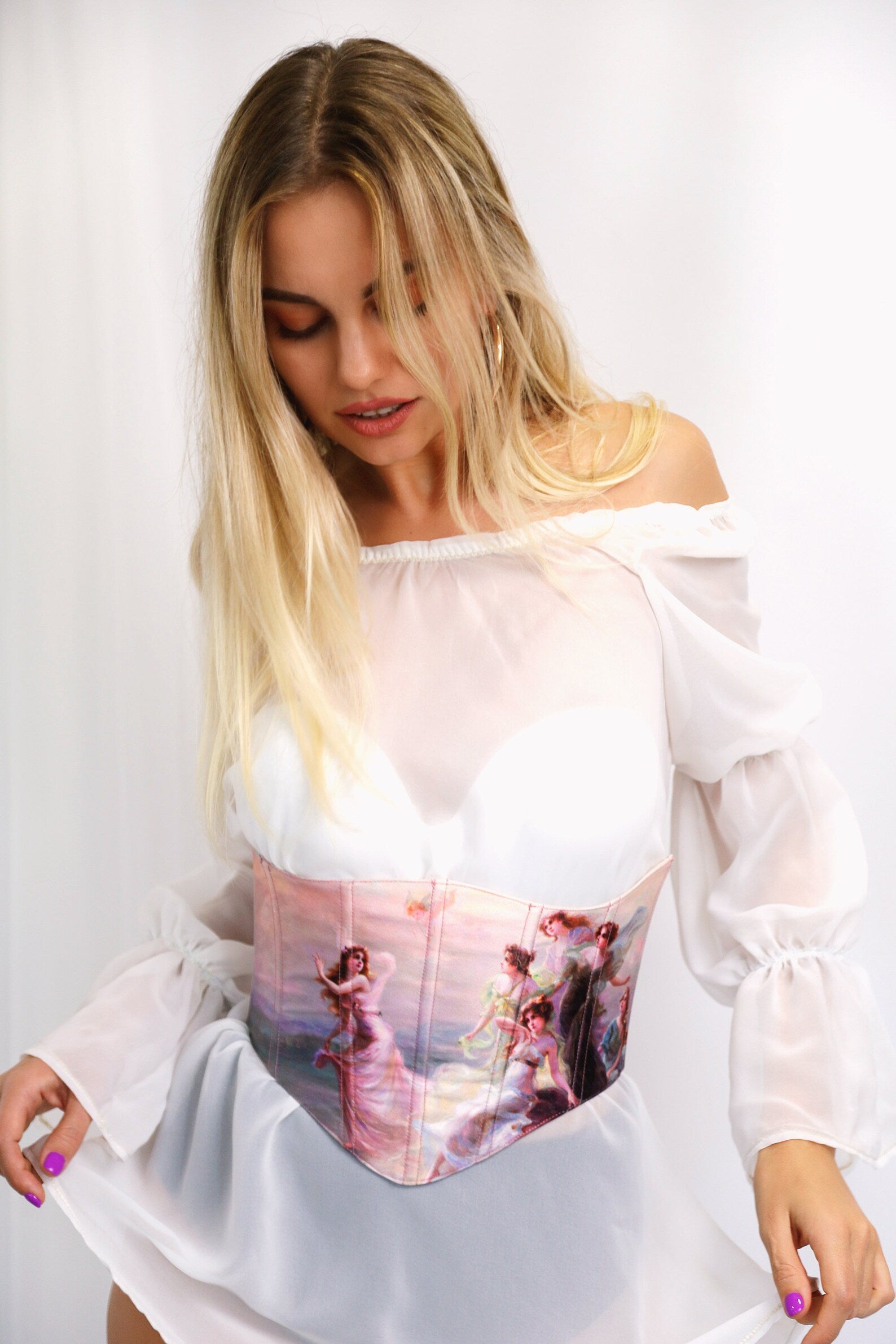 Pink tailor made under bust corset on white background