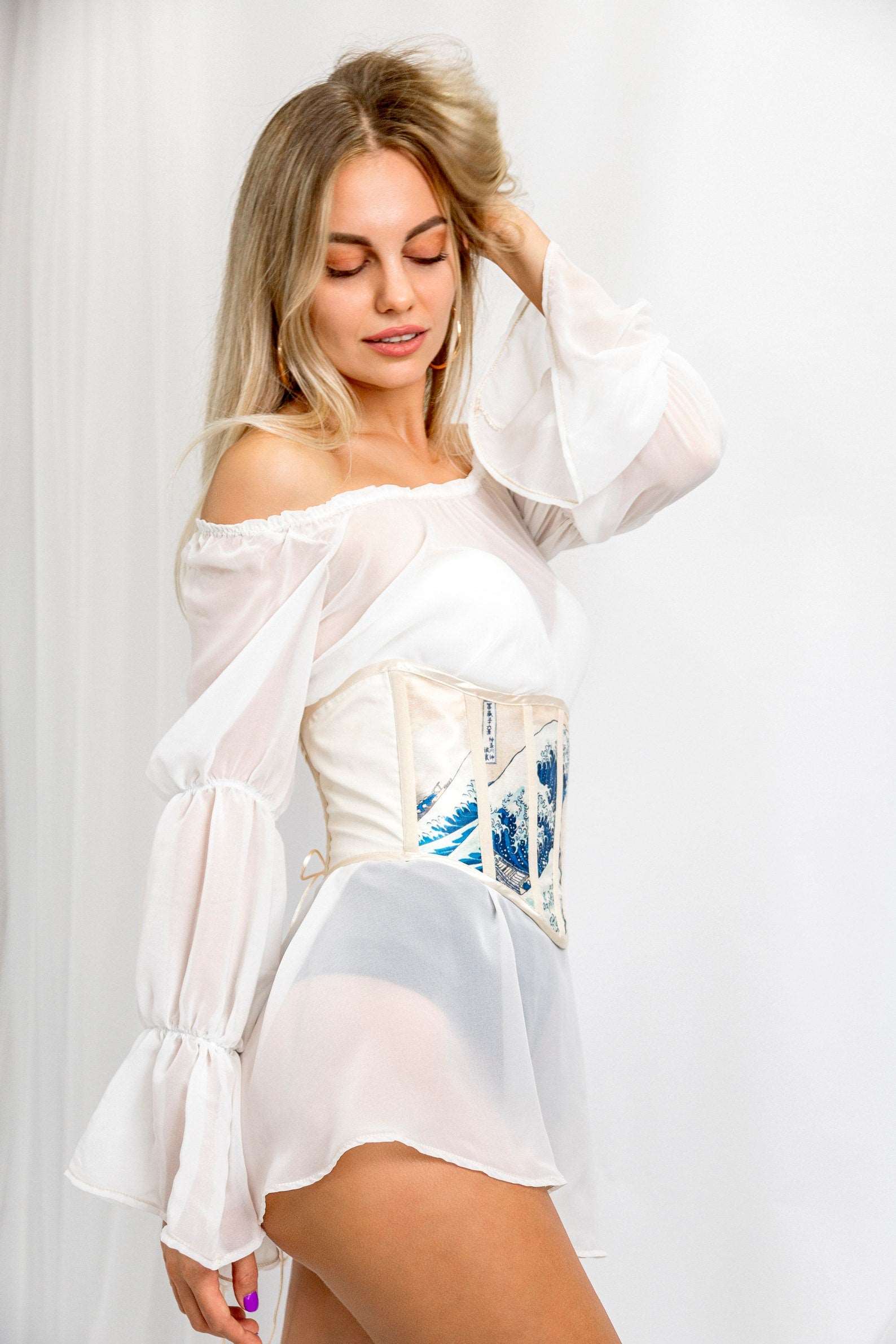 Waspie corset belt worn with a high-waisted skirt, perfect for a romantic look