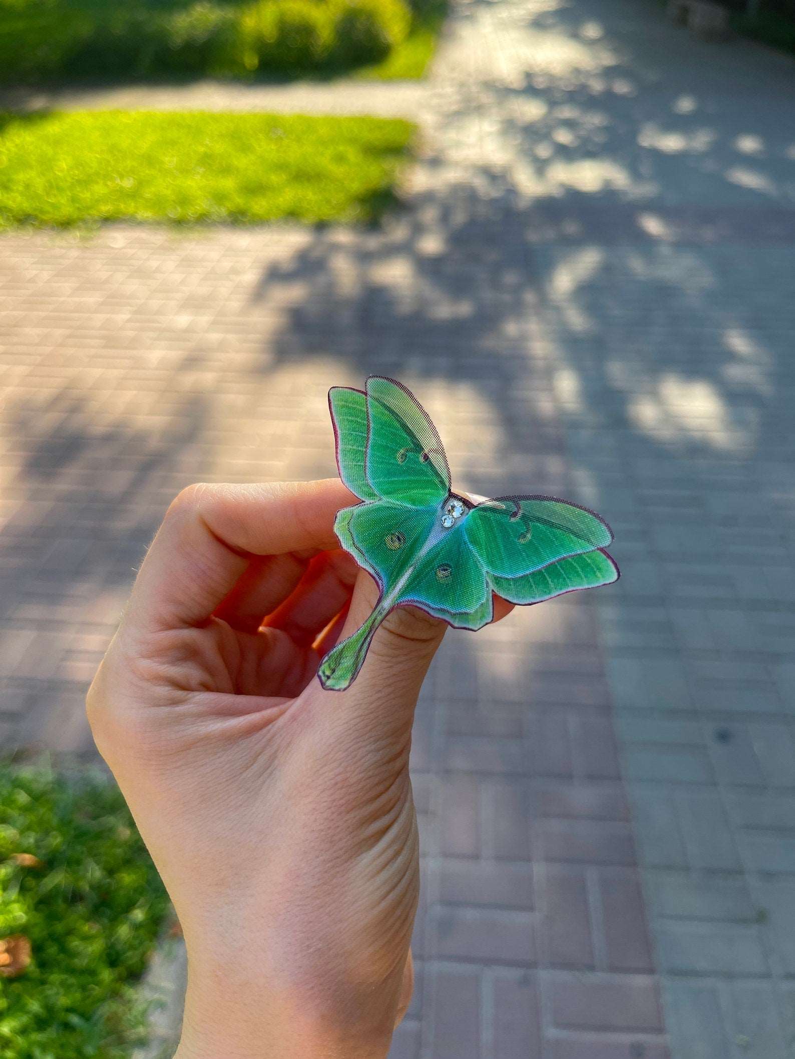 Luna Moth Ring on finger for size comparison