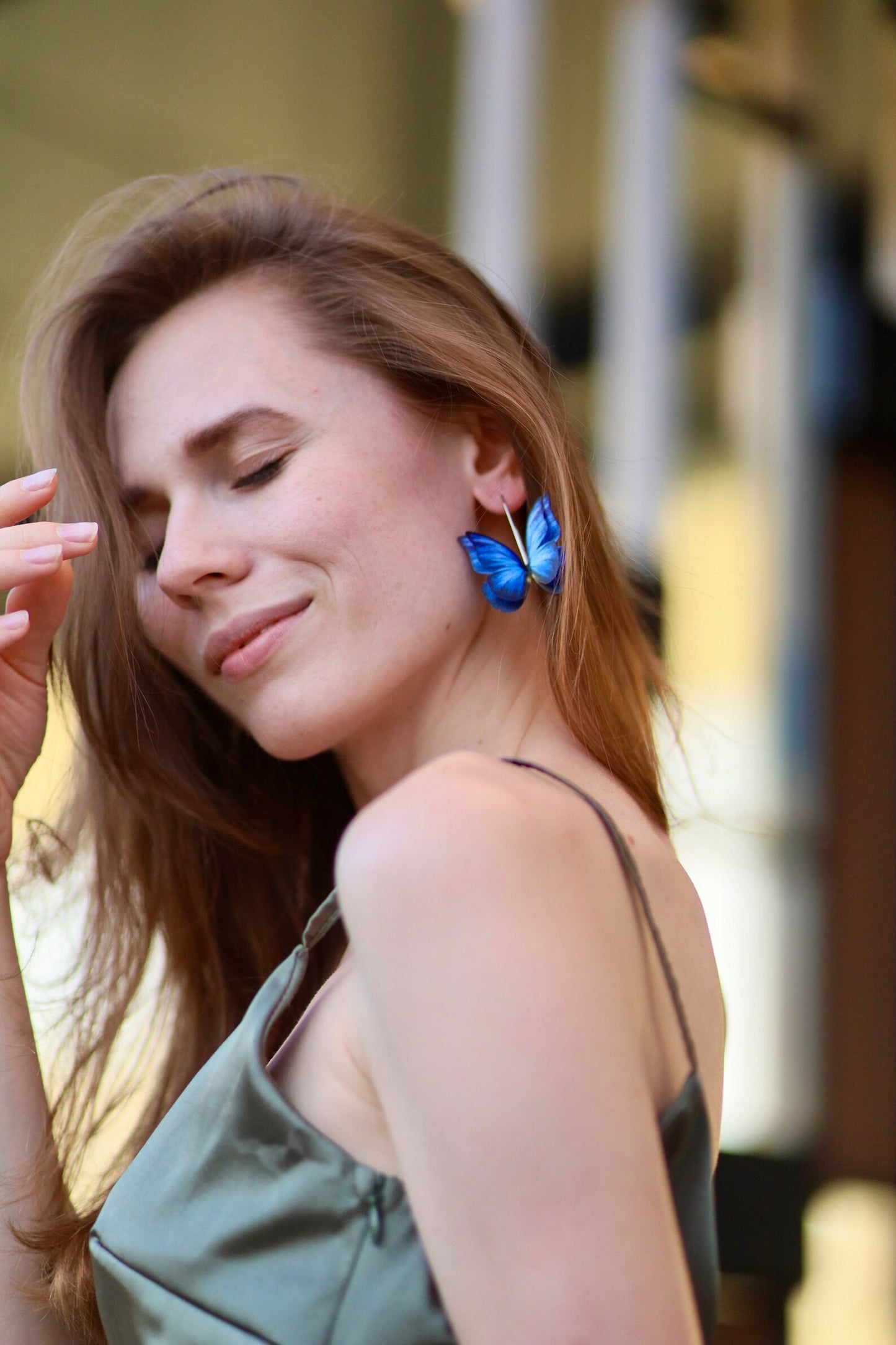 Blue butterfly earrings with intricate floral patterns and boho vibes