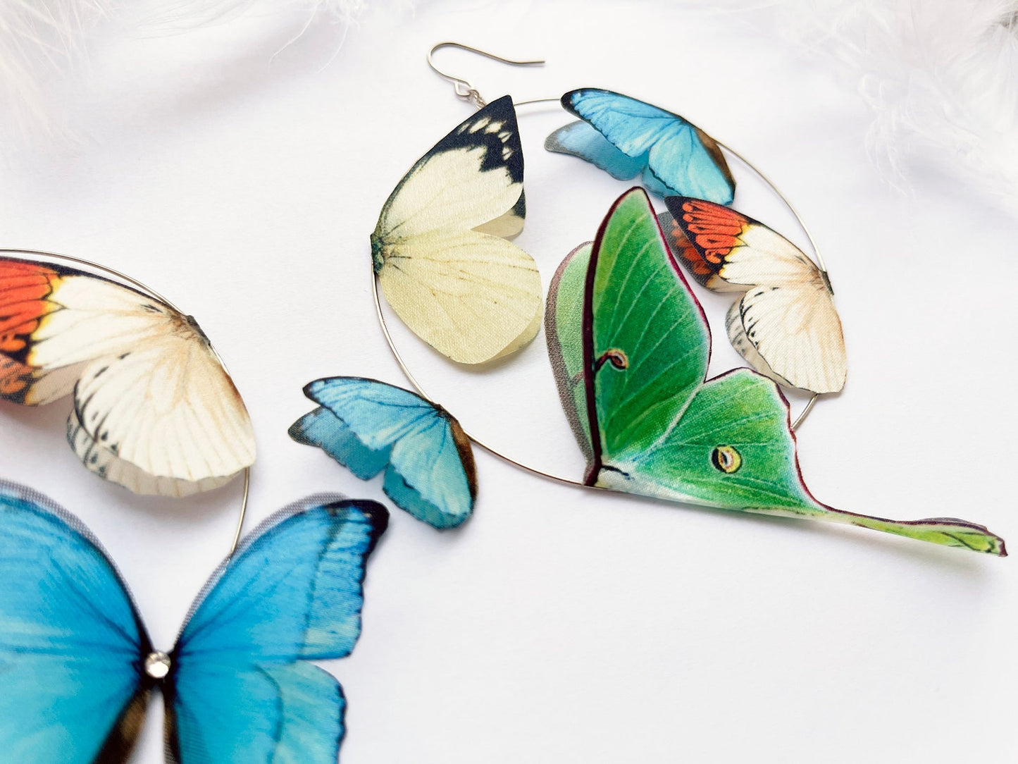 Luna moth earrings in boho style on silver hoops