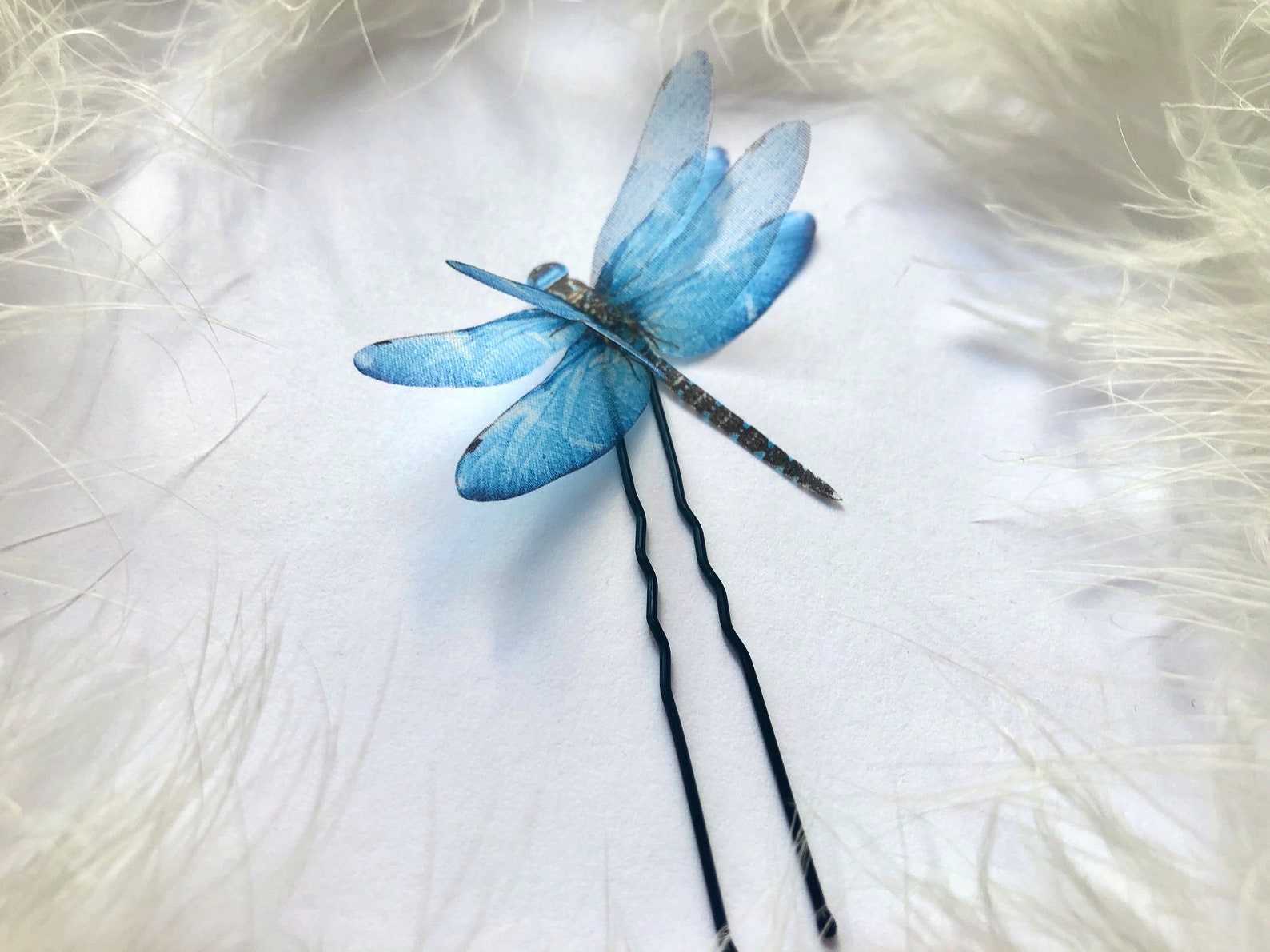 Handmade dragonfly hairpin with a 3D fluttering effect, displayed on a white backdrop