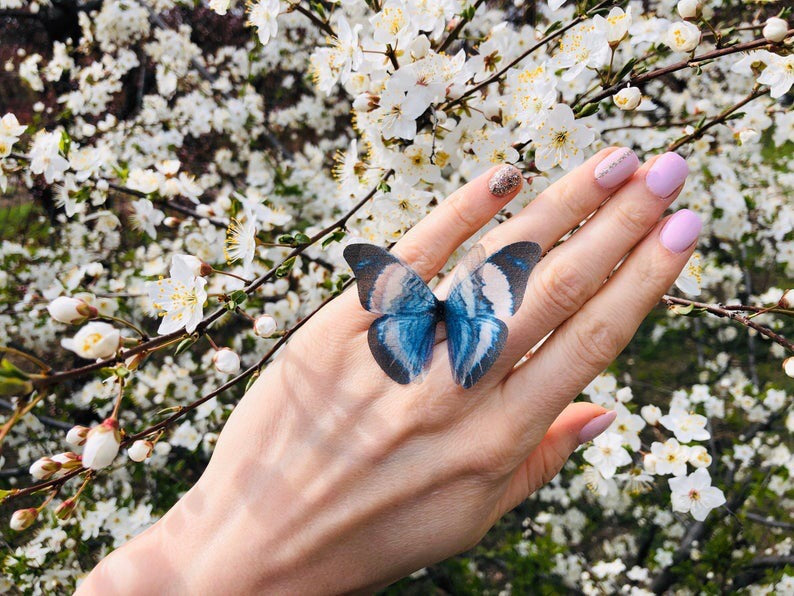 Close-up of handmade silk butterfly wing on adjustable ring band