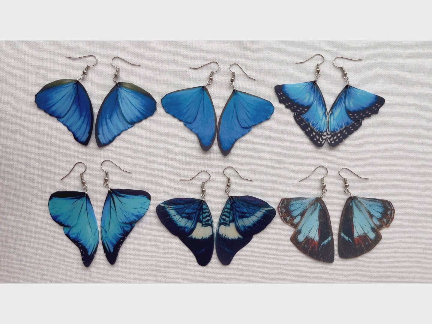 Whimsical fairy wing earrings in shades of blue