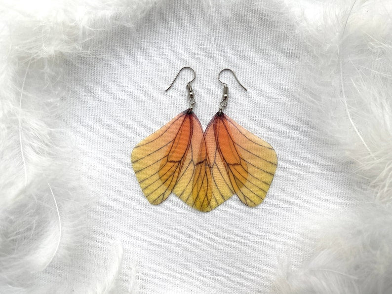 Colorful cicada earrings with yellow accents