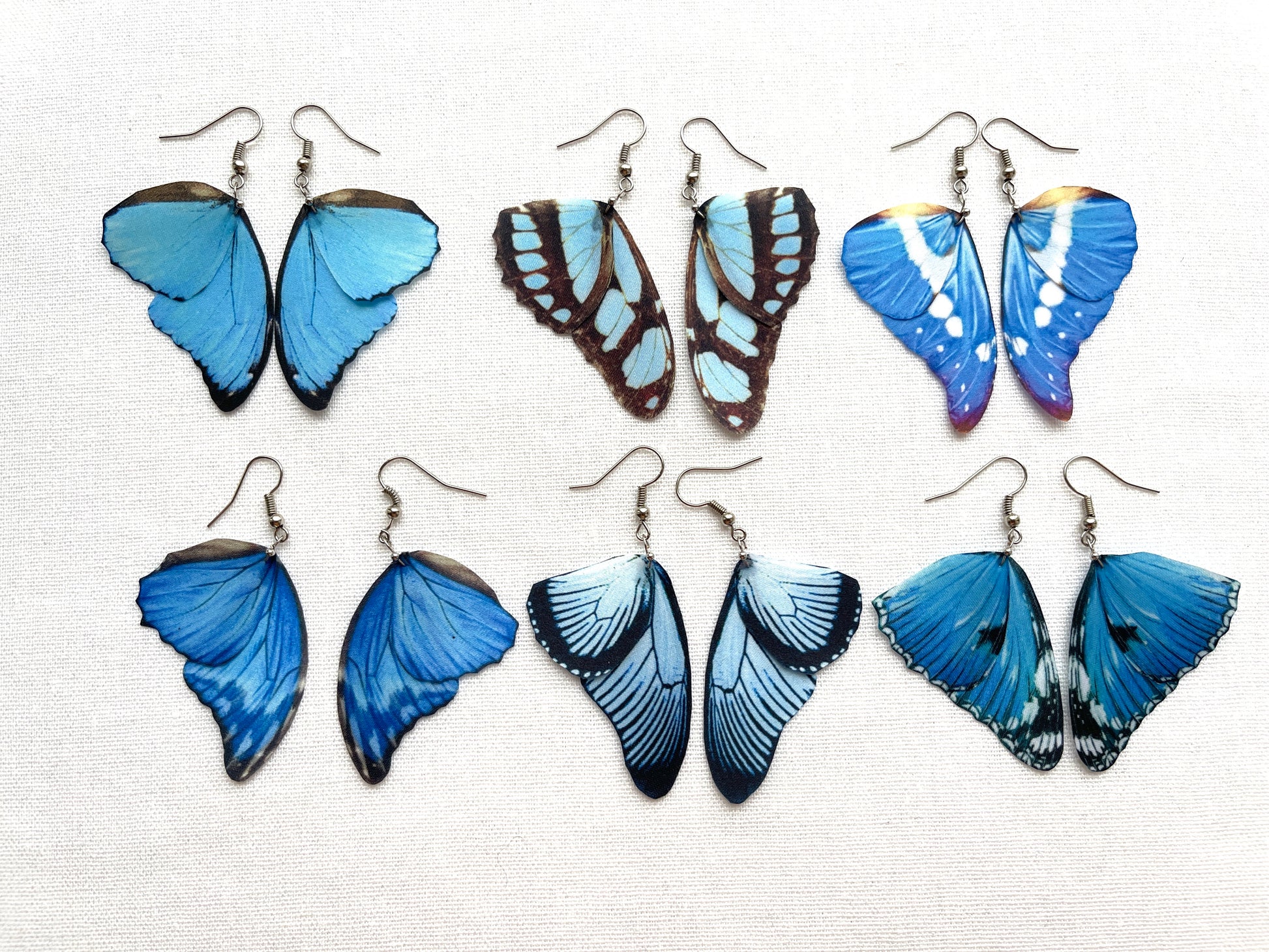 Blue butterfly wing earrings in different designs