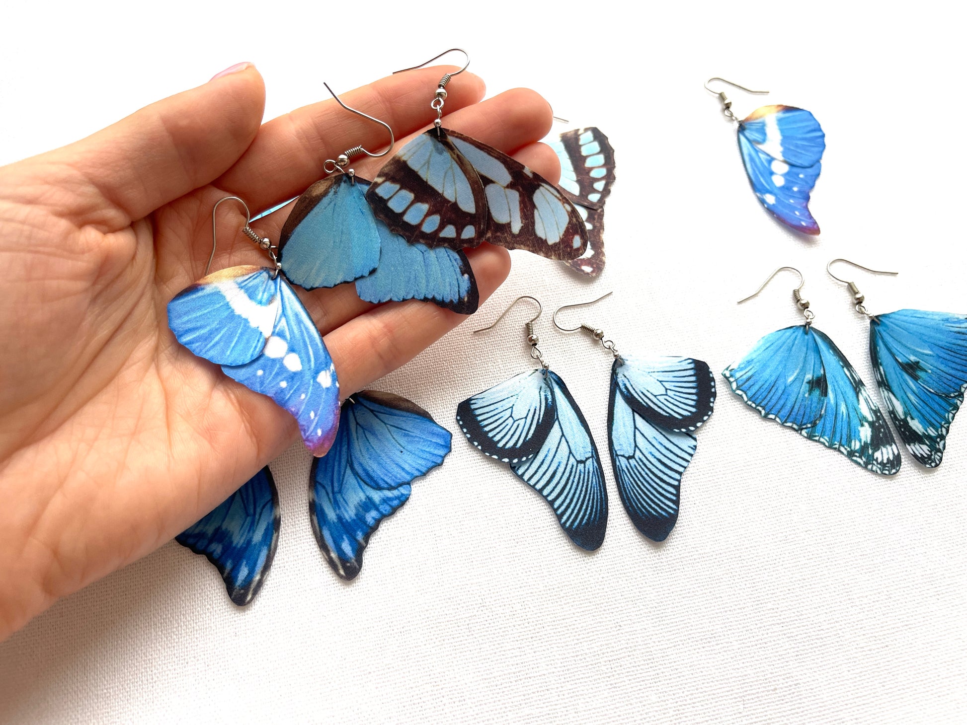 Elegant cobalt blue wings earrings with intricate details