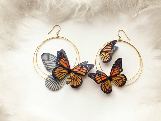 Front view of Monarch Butterfly Hoop Earrings on white background