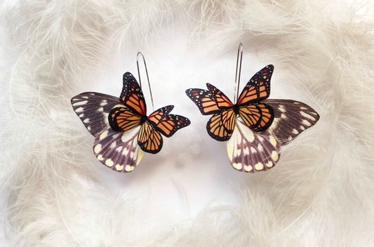 Monarch butterfly wing earrings hanging elegantly