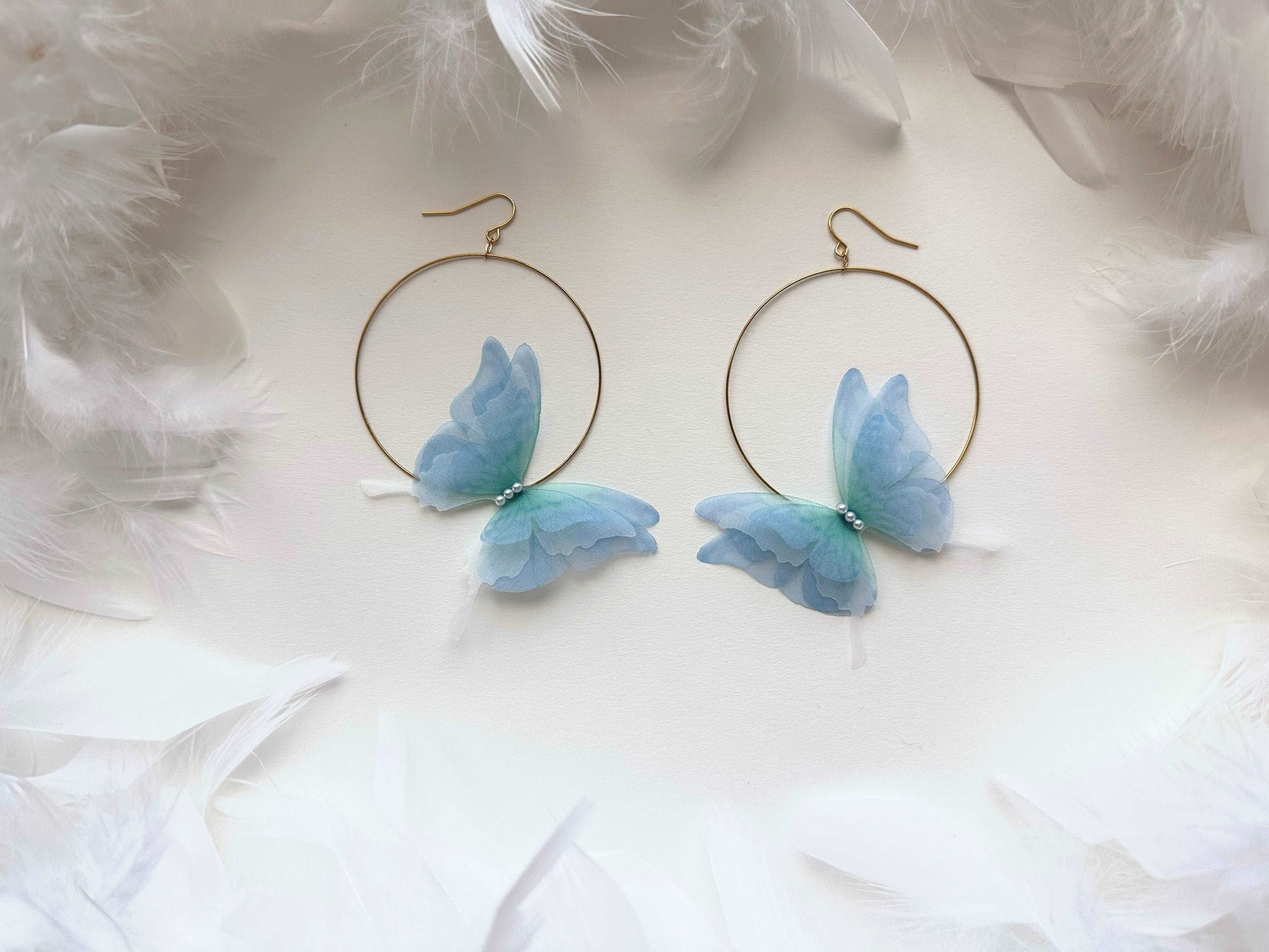 Ocean blue hoop earrings with butterflies