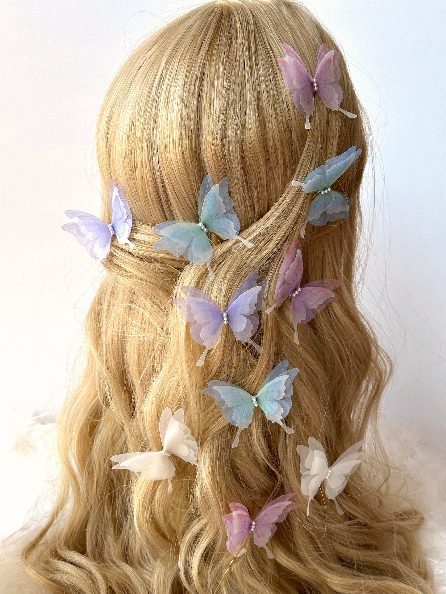 Floral hair pins with fluttering butterfly details