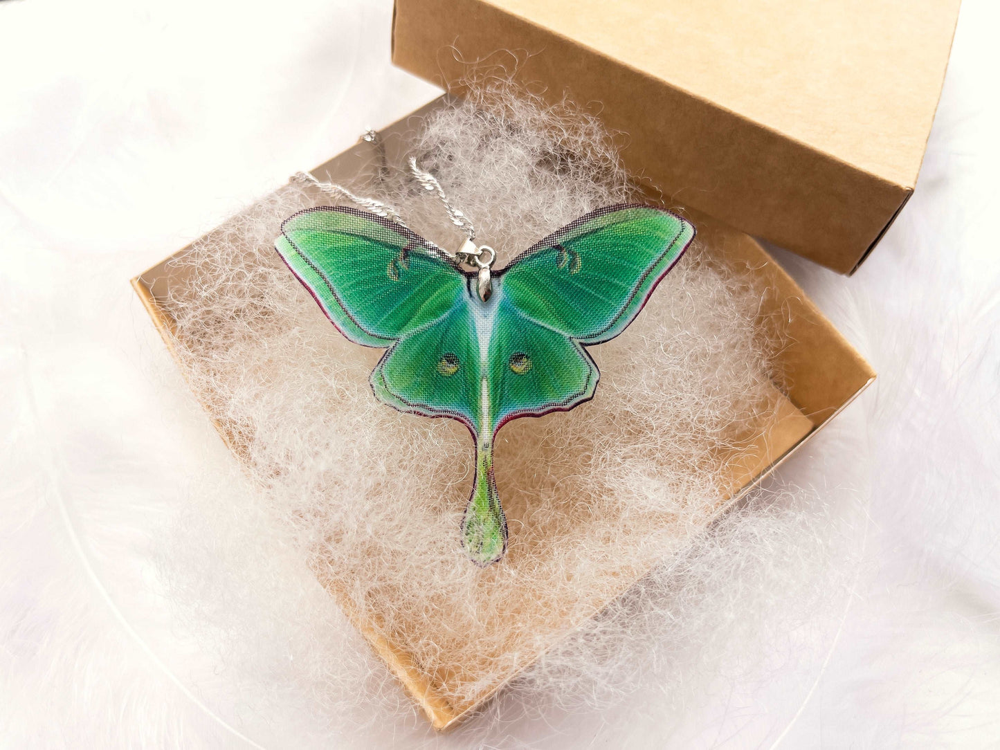 Side view of the Green Lunar Moth Pendant - Perfect for layering or wearing on its own