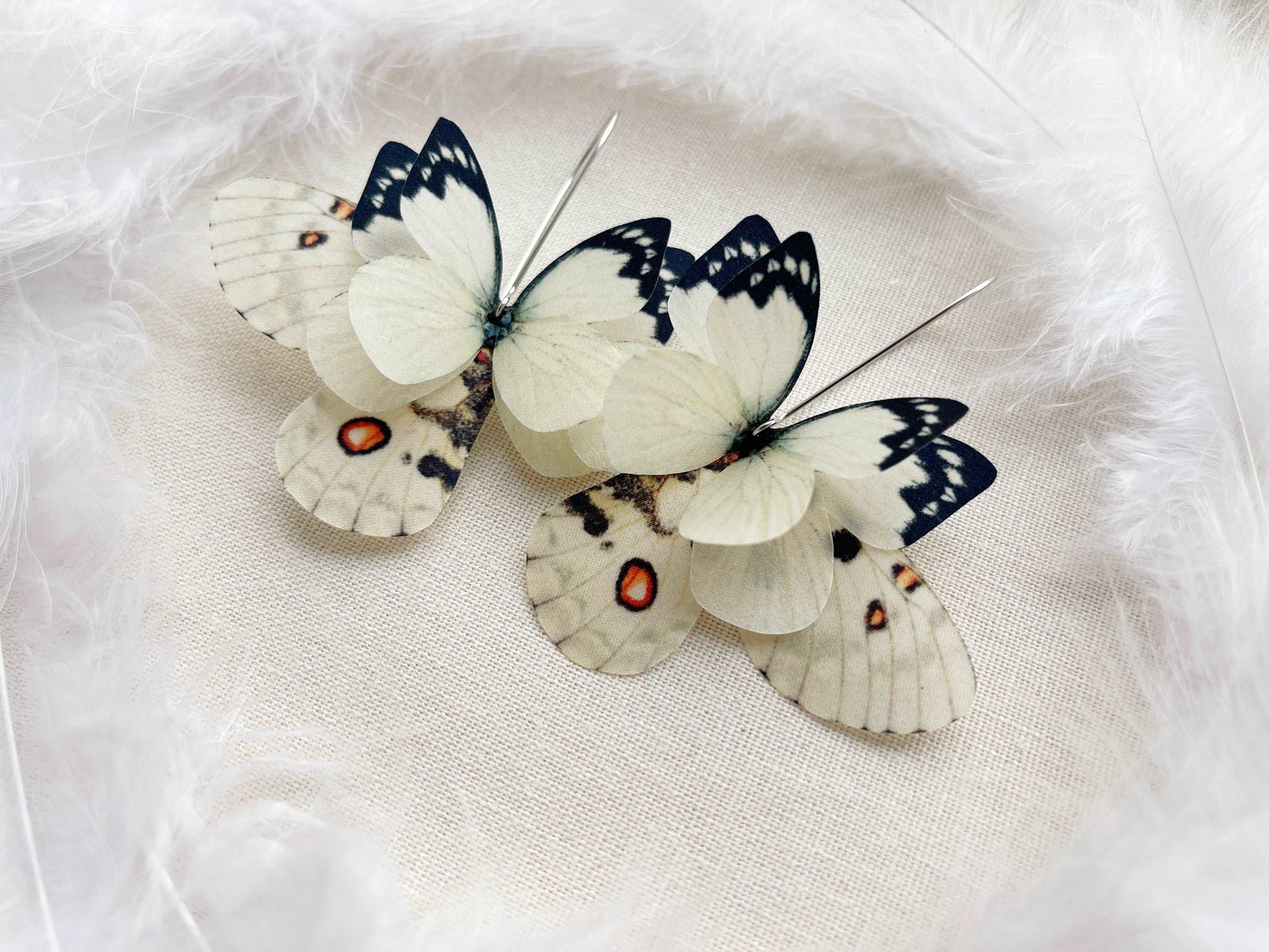 Unique asymmetrical moth wing earrings in ivory color