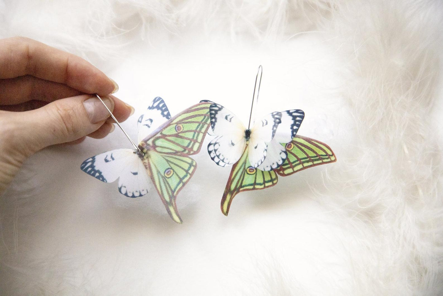Handmade ivory butterfly wing earrings for a whimsical look