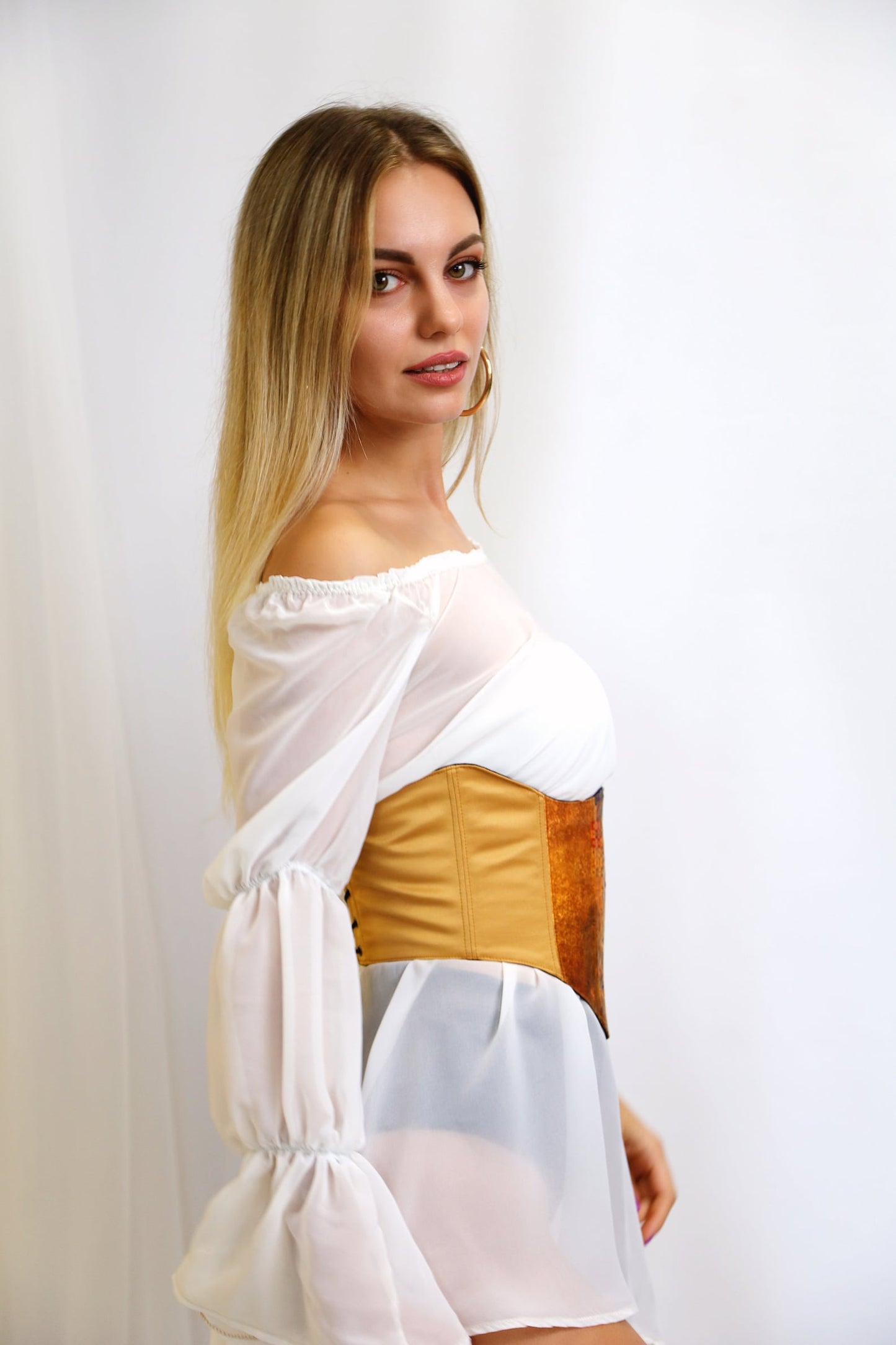 Wrap-around gold corset belt with adjustable lacing for a perfect fit