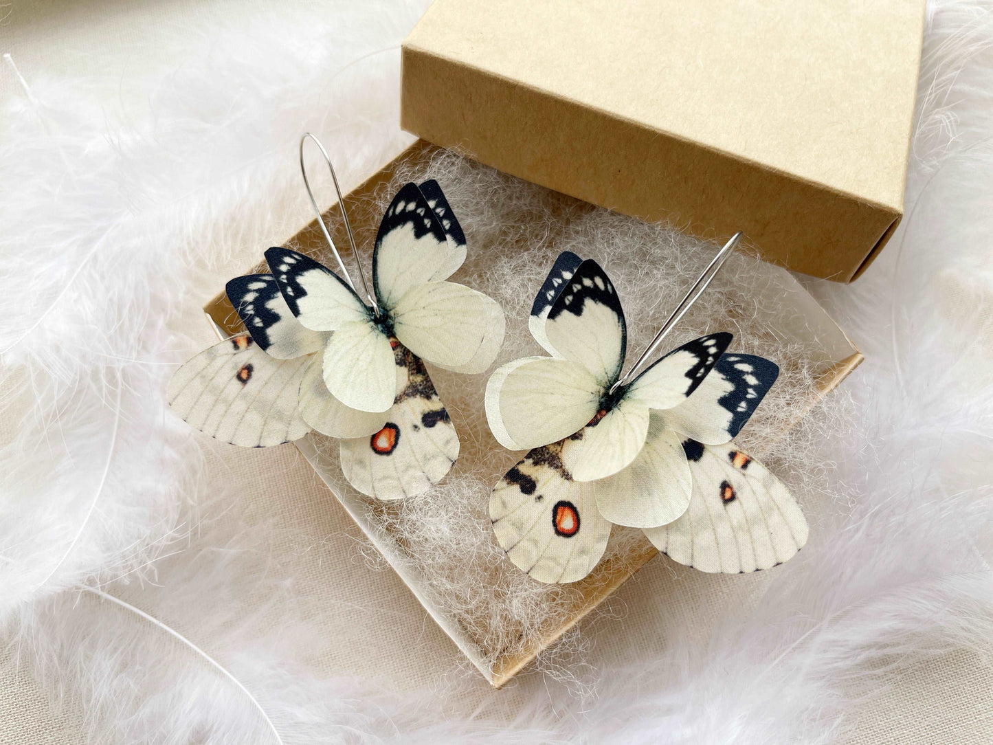 Mismatched dreamy butterfly earrings in ivory color