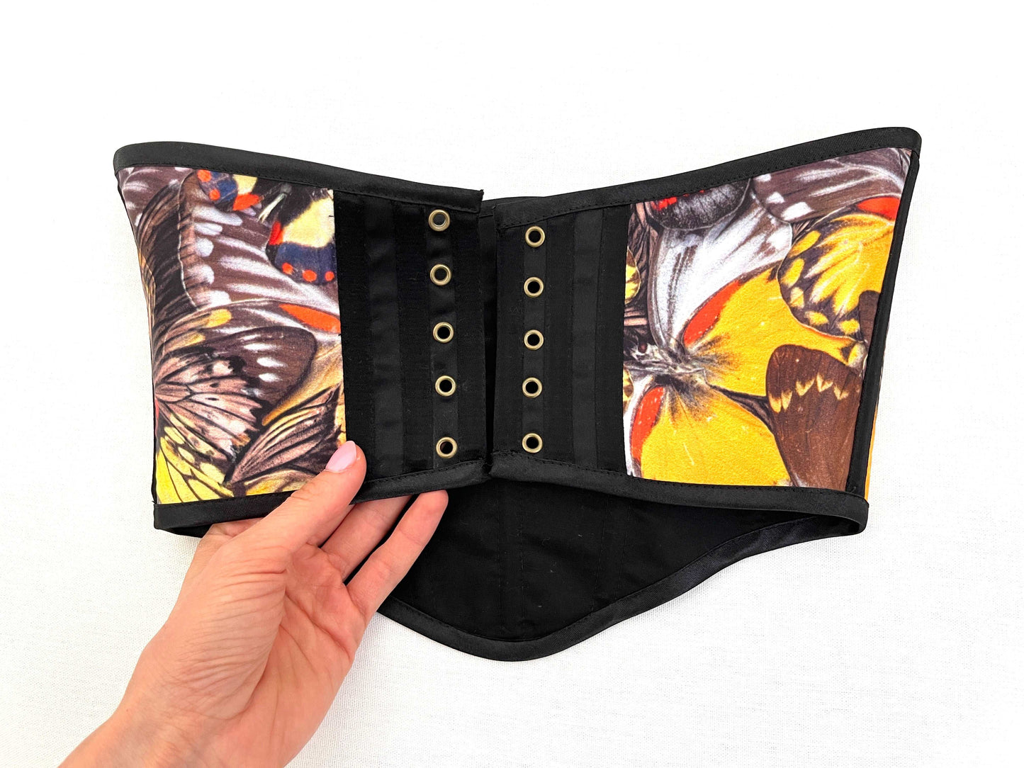 Cottagecore-inspired corset top in black with butterfly design
