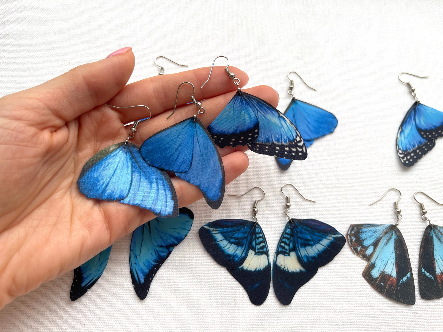 Beautiful blue butterfly wings on delicate earrings