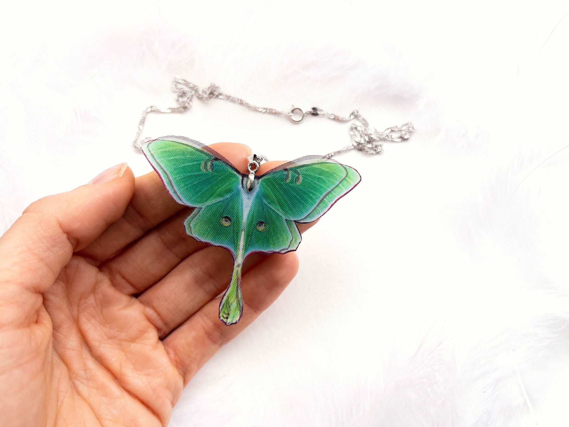 Handcrafted Green Lunar Moth Pendant on a delicate silver chain - Eco-friendly nature-inspired jewelry for fashion-conscious women