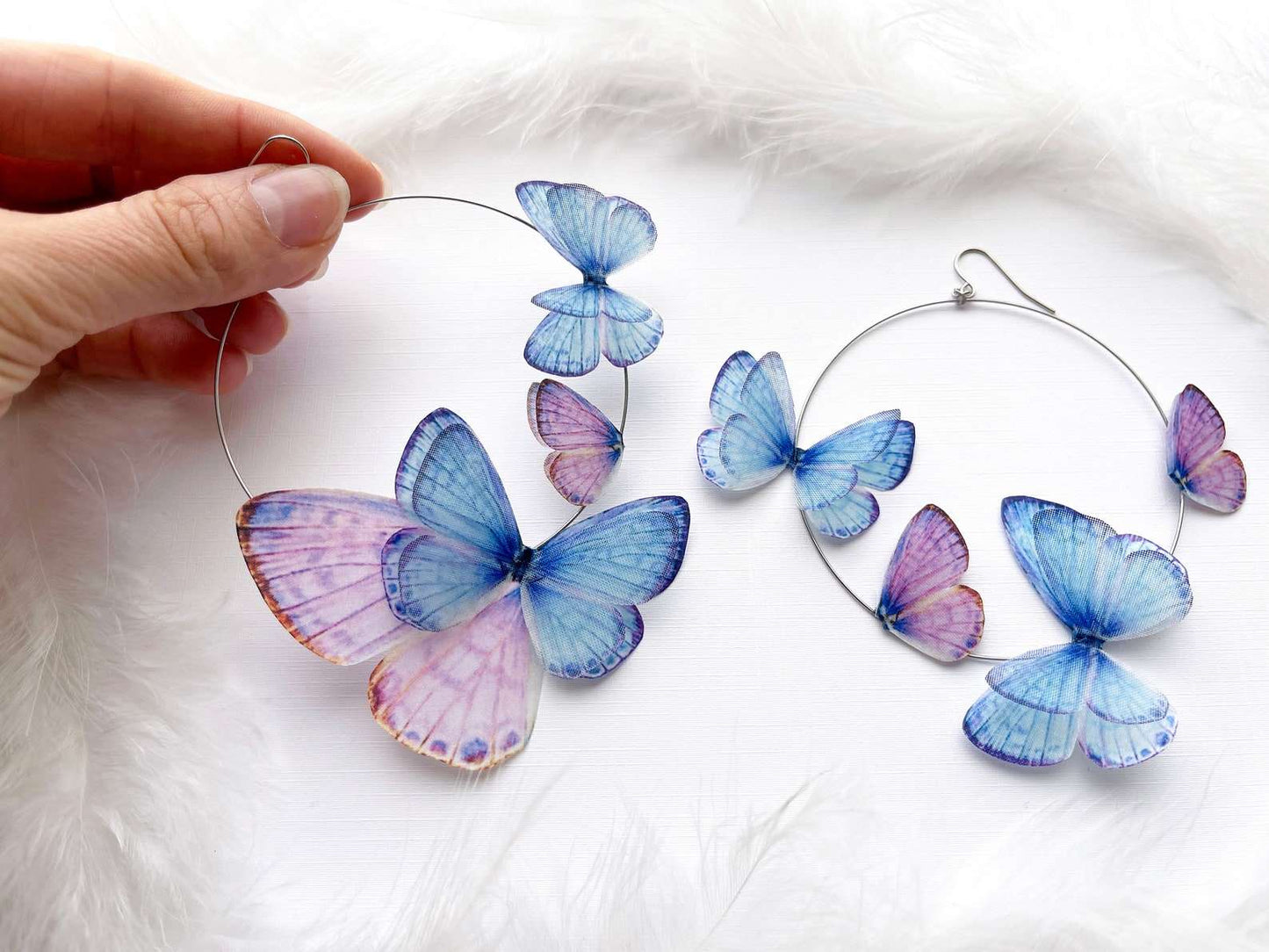 Handcrafted Boho Hoop Earrings with Faux Butterflies on White Background