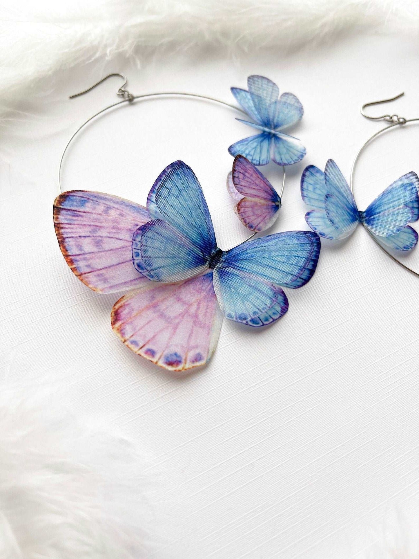 Earrings with Faux Butterflies on White Background