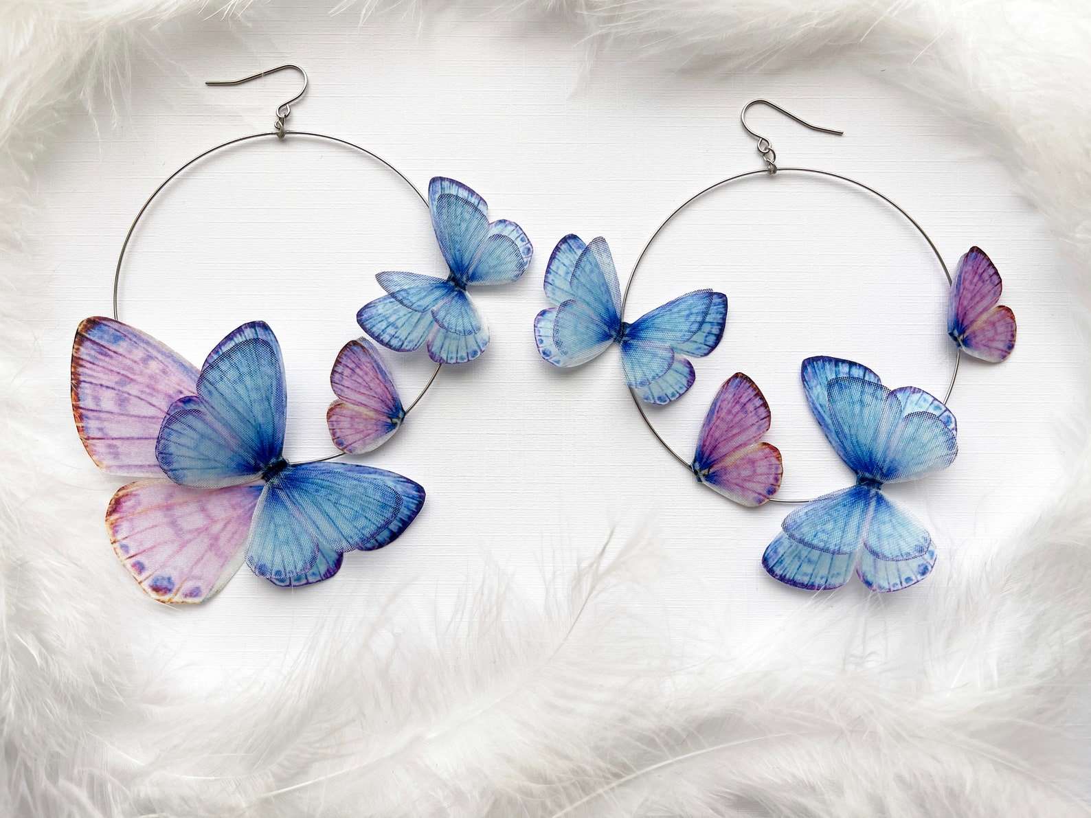 Handmade Boho Hoop Earrings with Faux Butterflies on White Background
