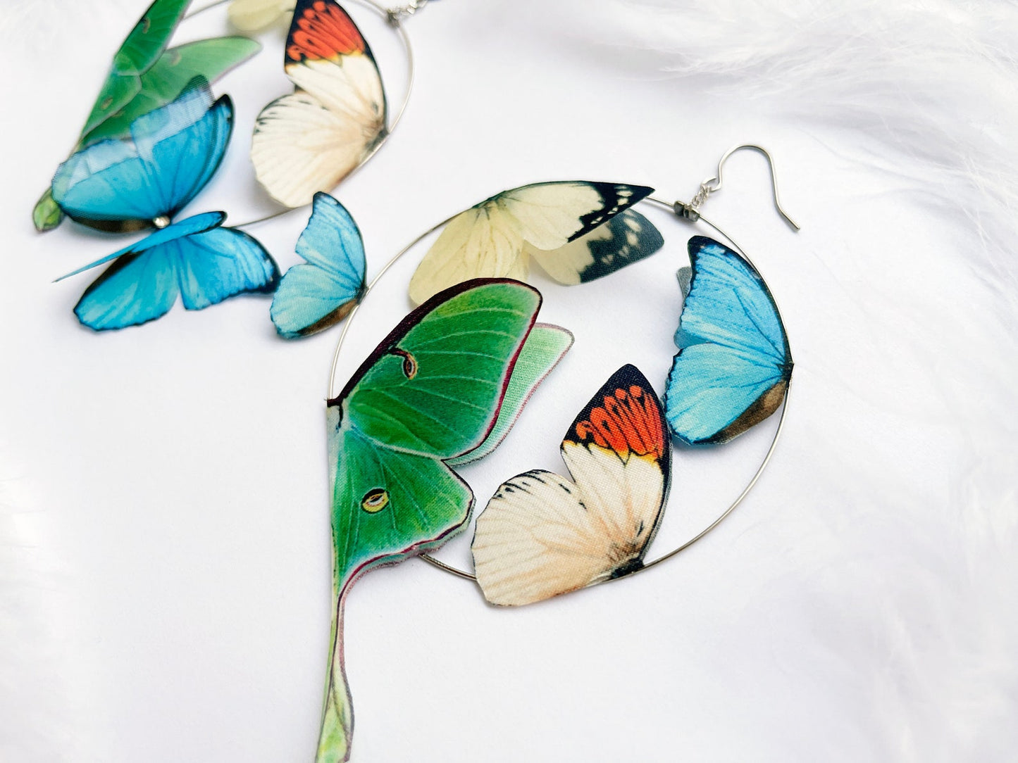 Custom floral design hoop earrings with butterfly and Luna moth charms
