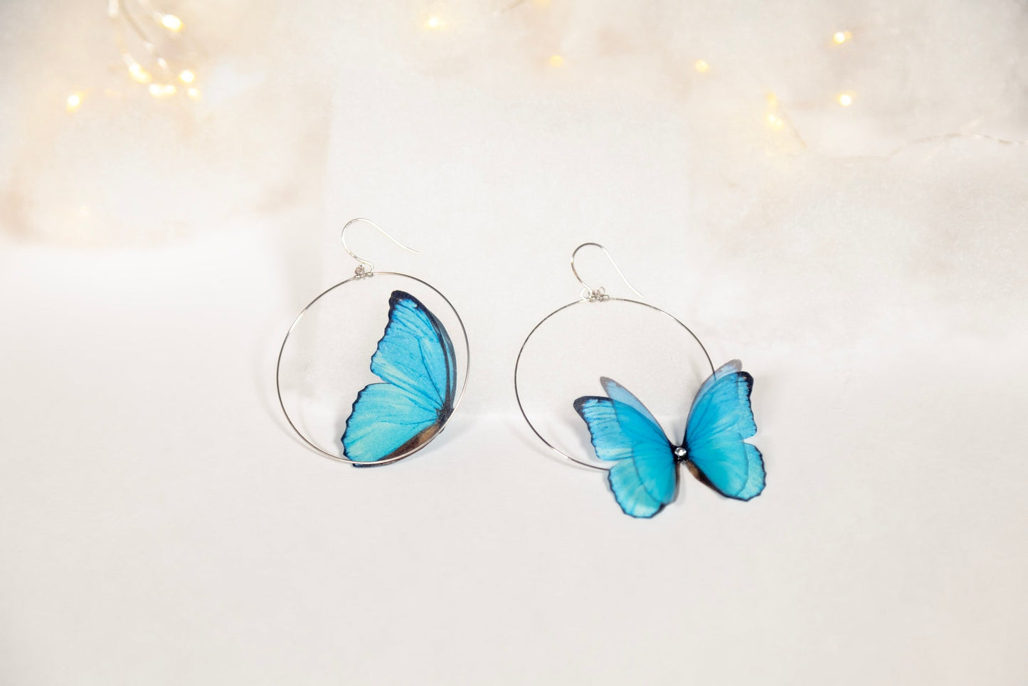 Blue Butterfly Hoop Earrings Modeled on Ear with Casual Clothing