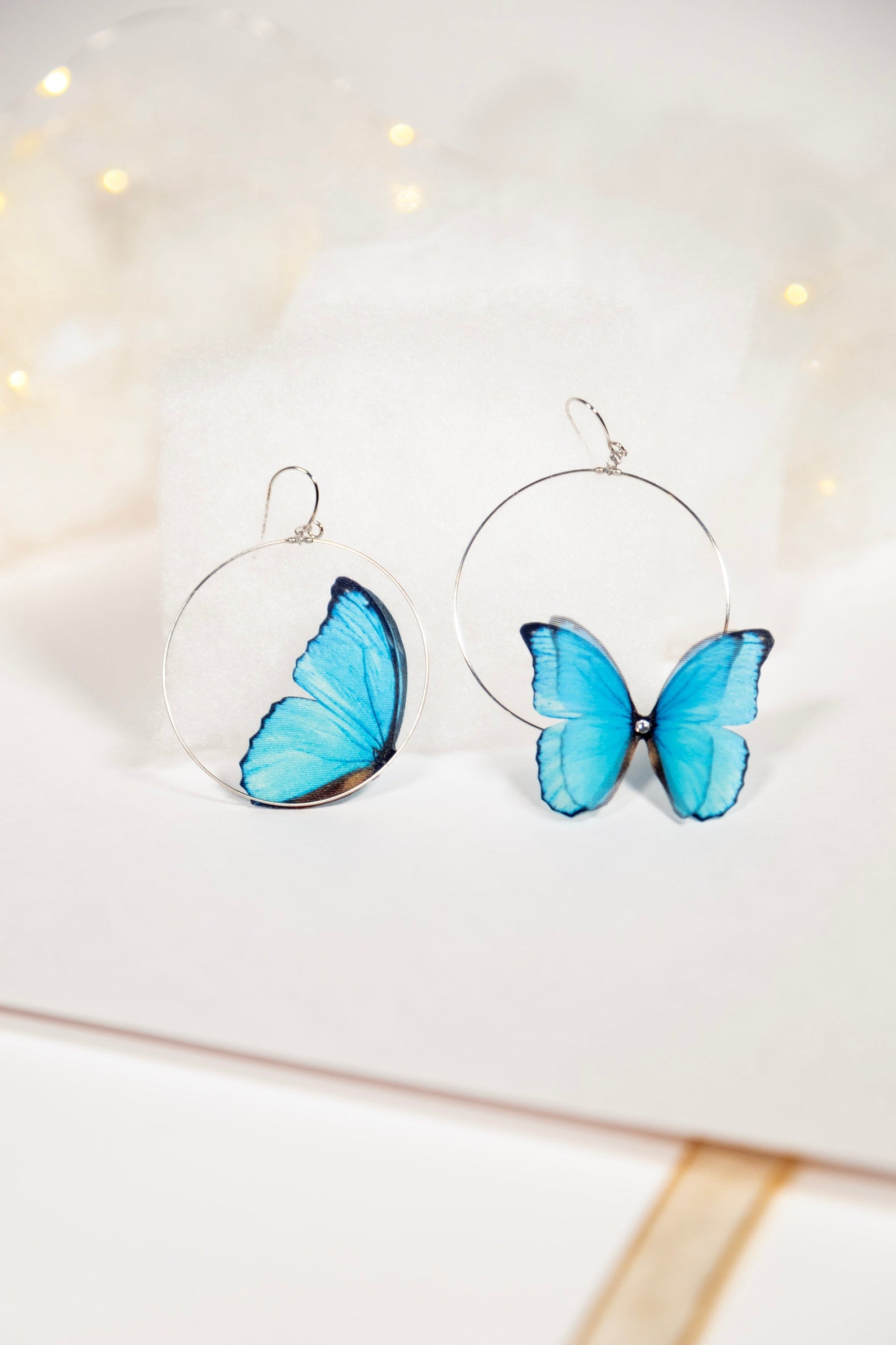 Blue Butterfly Hoop Earrings Modeled on Ear with Boho Style Clothing