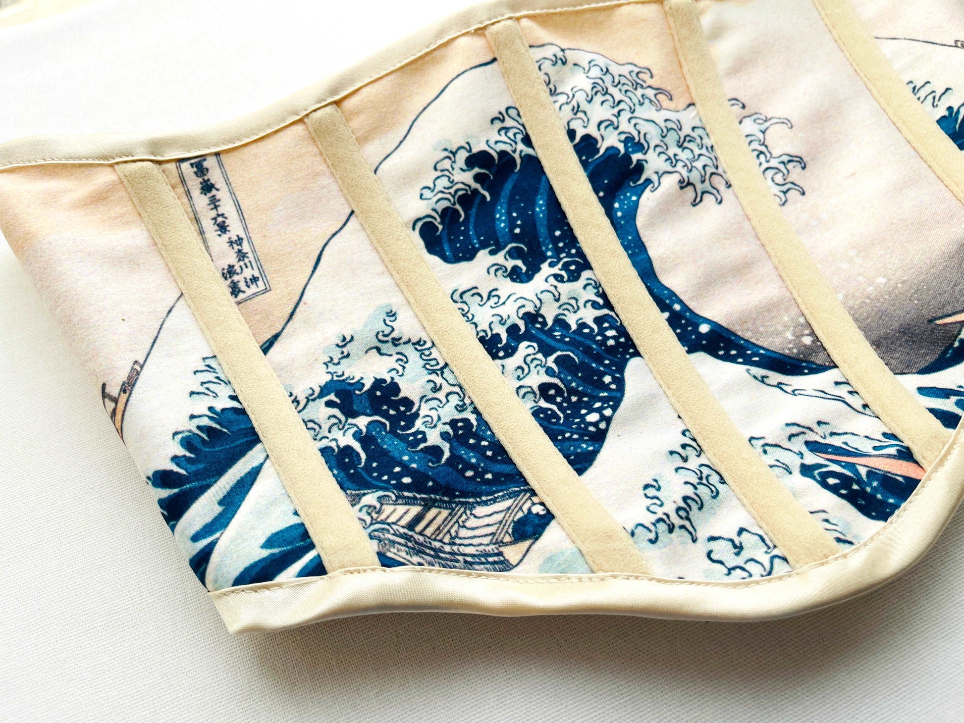 Close-up of the Handmade Vintage Under Bust Corset - The Great Wave off Kanagawa detailing on a white background.