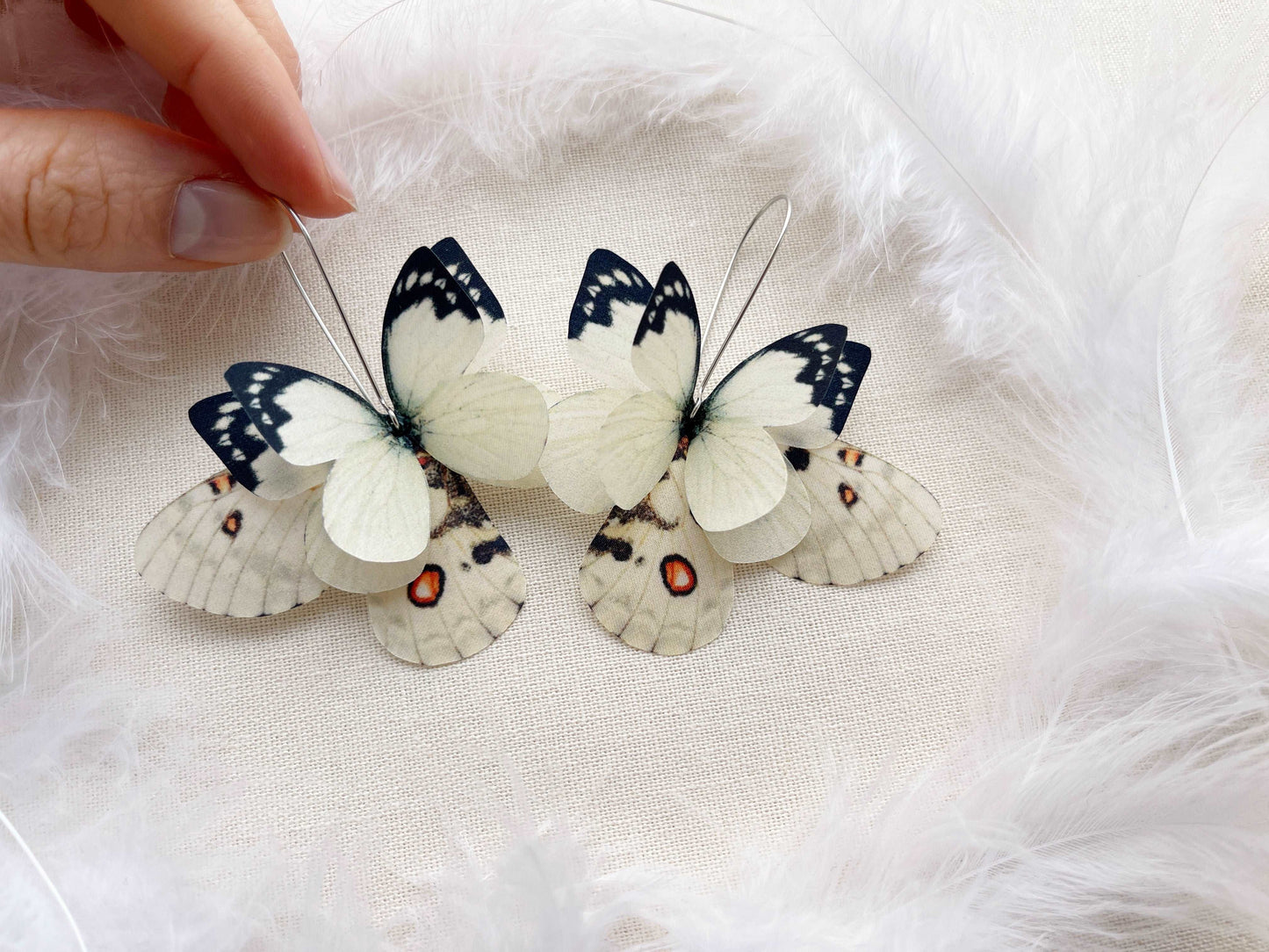 Cool mismatched butterfly wing earrings in ivory color